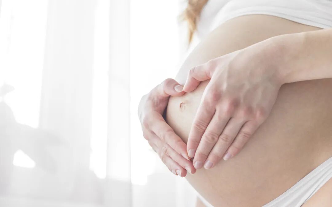 A pregnant woman during prenatal care at AMCARE Beijing