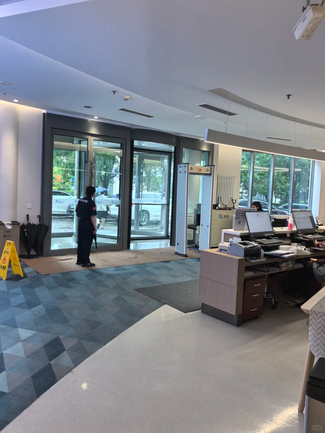 Hospital main lobby entrance with security and reception