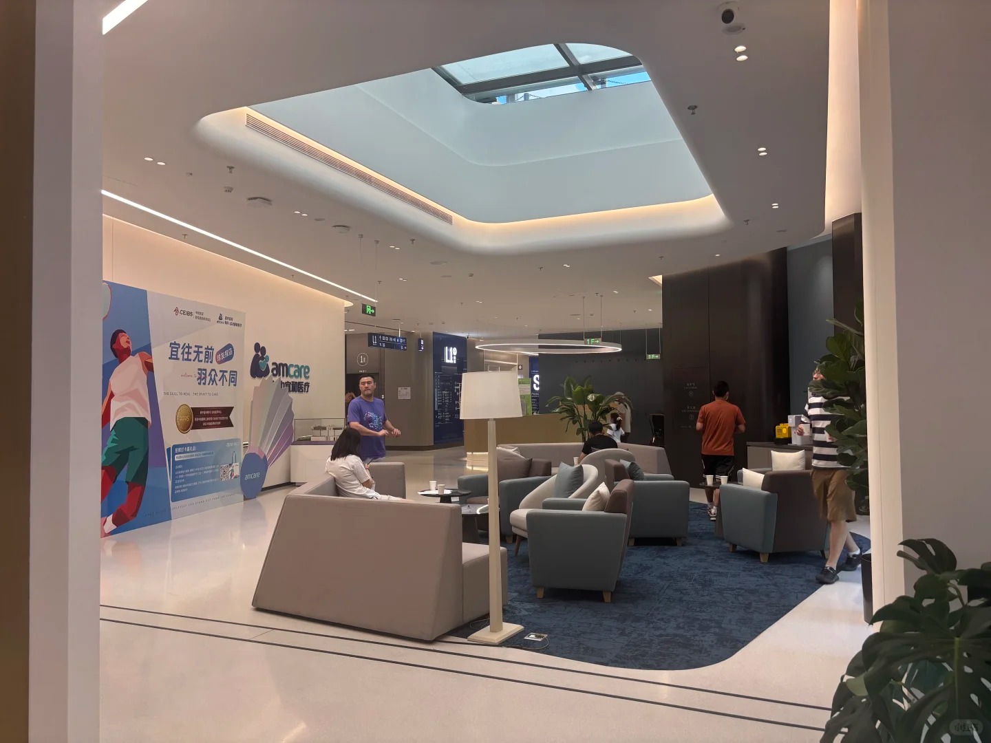 Bright main lobby with skylight and modern seating